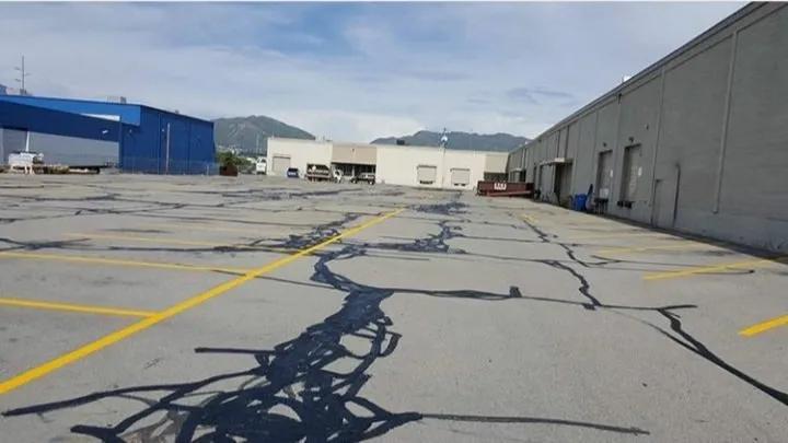 stripped parking lot and warehouses